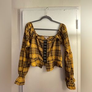 Adorable plaid shirt giving clueless vibes.